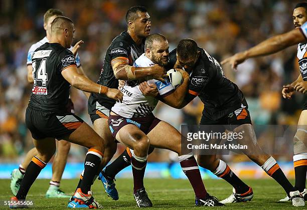 Nate Myles of the Eagles is tackled during the round two NRL match between the Wests Tigers and the Manly Sea Eagles at Leichhardt Oval on March 14,...