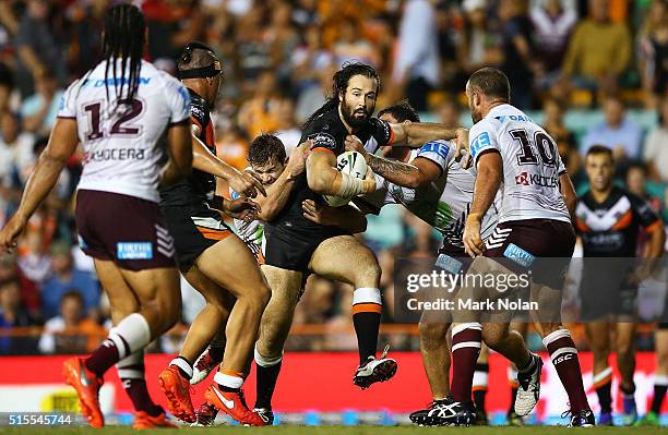 Aaron Woods of the Tigers runs the ball during the round two NRL match between the Wests Tigers and the Manly Sea Eagles at Leichhardt Oval on March...