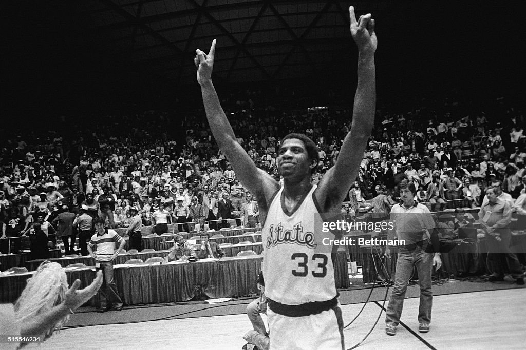 Magic Johnson With Hands Raised in Victory