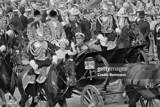 Queen Elizabeth and her husband, Prince Philip, riding in the semi-state coach to St. Paul's Cathedral for the wedding of their son, Prince Charles,...