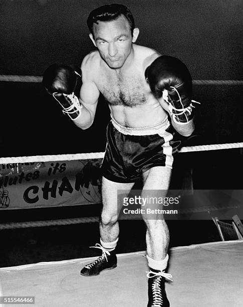 Carmen Basilio, welterweight champion of the world, poses at his Alexandria, Bay, N.Y. Training camp where he is readying for his September 23rd...