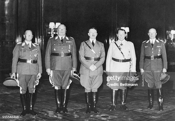 Adolph Hitler and a group of the Air Marshals commanding the German all out air attack on the embattled British Isles. Left to Right, General Field...