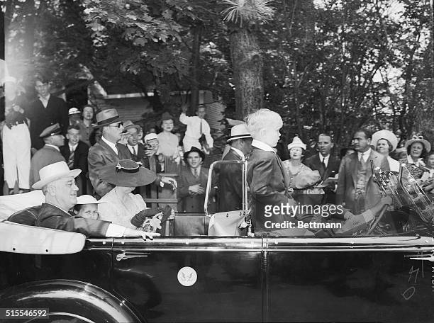 President and Mrs. Roosevelt, and their grandchildren of Mrs. John Boettiger, are shown in the presidential car, arriving at Union Church here, to...
