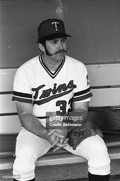 Newly acquired Minnesota Twins' pitcher Mike Marshall sits in the dugout before the game with the Baltimore Orioles. Marshall signed with Minnesota...