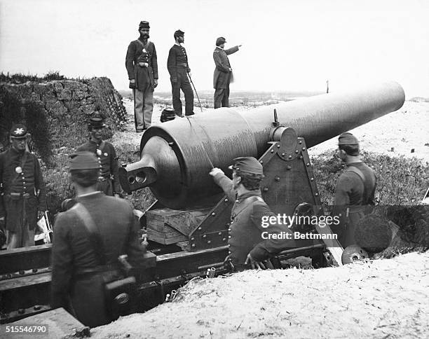 Gunners of General William B. Hazen's division of the 15th Corps stand around a field gun at Fort McAllister in Richmond Hill, Georgia.