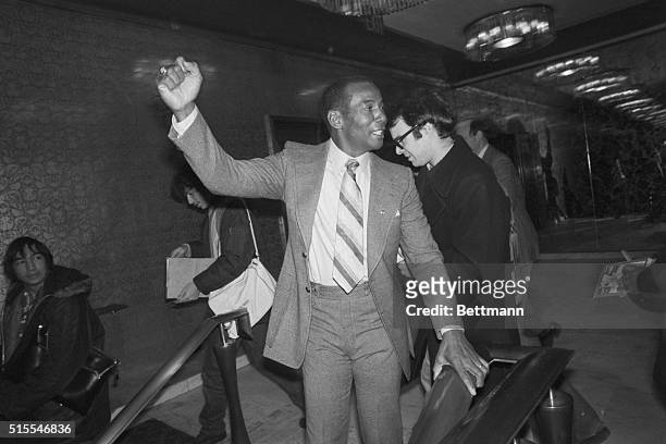 Former Chicago Cubs first baseman Ernie Banks smiles and waves after being elected to the Hall of Fame in his first year of eligibility. He is the...