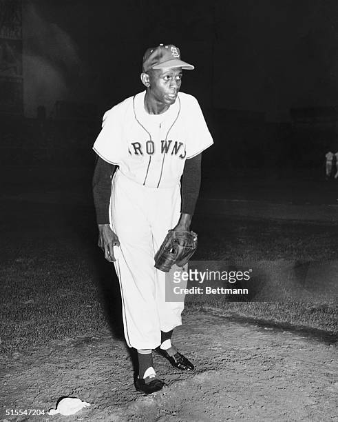 Satchel Paige, famed Negro Leagues pitcher, stands on the pitcher's mound during one of his scoreless performances with the St. Louis Browns of the...