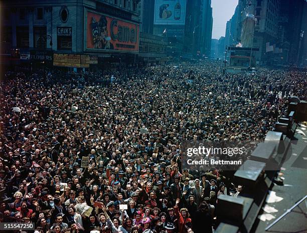 Crowds take to the streets on V-E Day, celebrating Germany's surrender in World War II.