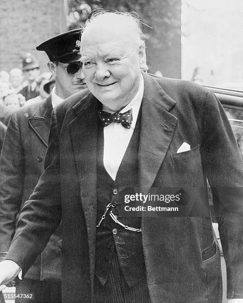 Sir Winston Churchill is shown arriving at No. 10 Downing Street yesterday morning after he called a special cabinet meeting to discuss the recent...