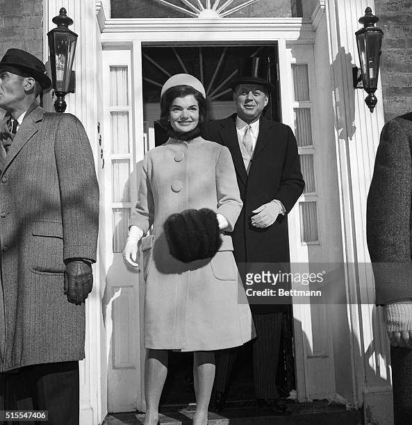 Headed For the White House. Washington, D.C.: John F. Kennedy, wearing top hat, and his wife, Jacqueline, leave their Georgetown home for the White...