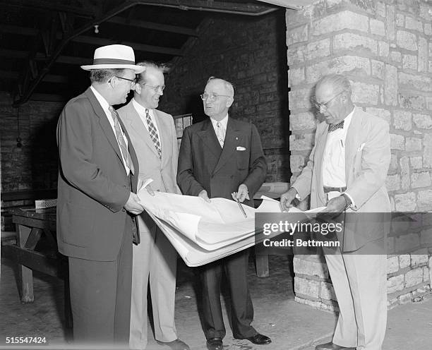 Former president Harry S. Truman thursday inspected the plans and white of his new library. Truman is shown pointing out a feature on the incomplete...