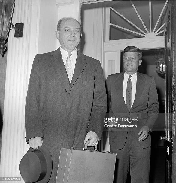 President-elect John Kennedy escorts Secretary of State designate Dean Rusk out of his Georgetown house.