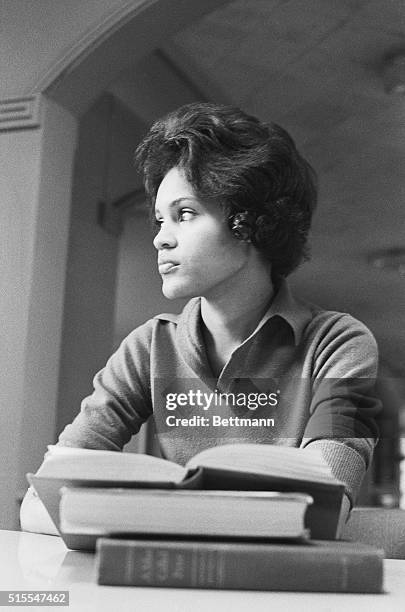 Charlene Hunter smiles over her books as she sits studying in Myers Hall, her dormitory at the university of Georgia. Charleyne, one of first two of...