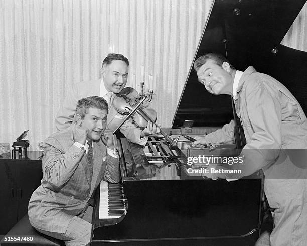 Red Skeleton tunes up the famous Liberace concert Grand, as the piano playing telewave idol and his fiddling brother George Shriek at the sounds....