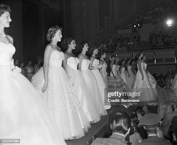 Lining up on stage at Long Beach, California, for the selection of 1954's Miss Universe are Miss Brazil, Maria Hacker Rocha; Miss Chile, Gloria...