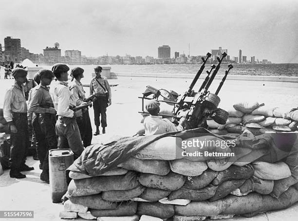 Cuban soldiers stand by an anti-aircraft artillery at the Havana waterfront in response to warning of an invasion from the United States.