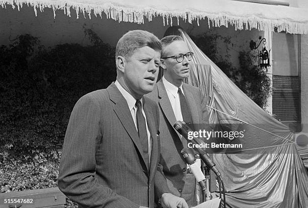 From the patio of his home, President-elect John F. Kennedy announces the selection of Professor Walter Heller of the University of Minnesota,...