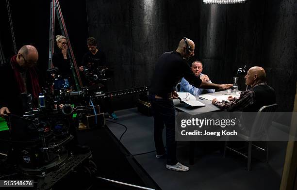 Director Uwe Greiner , actor Detlef Bothe and criminal investigator and profiler Stephan Harbort talk on set during the shooting for the new local...