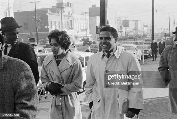 Athens, Georgia: Charlayne Hunter, , and Hamilton Holmes walk down Athens sidewalk enroute to University of Georgia registrar's office to become...