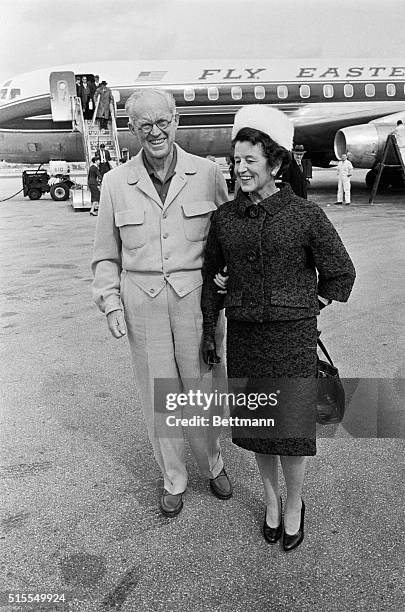 Mrs. Joseph P. Kennedy, Sr., mother of President-elect Kennedy, is greeted by her husband upon her arrival at Palm Beach Airport. Both she and her...