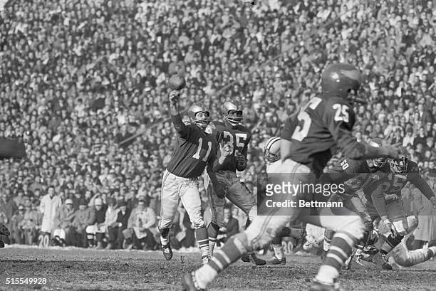 Philadelphia: Eagle's Norman Van Brocklin unleashes one of his many completed passes against Green Bay in final period of NFL Championship game....