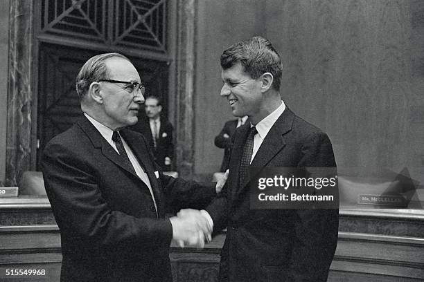 Robert Kennedy, brother of the President-elect, is congratulated by Senator John McClellan, , after his nomination to be Attorney General was...