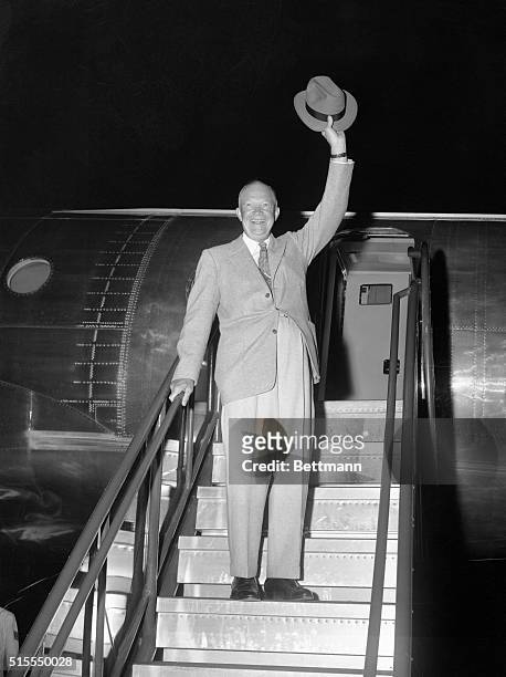 President Eisenhower waves goodbye at Lowry Air Force Base before boarding the Presidential plane, Columbine III, for the nation's capitol. The...