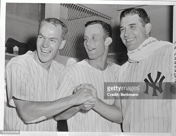 Heroes of today's Yankee victory over the Indians are shown happy as larks back in the dressing room following the game. From left are Yanks: Andy...