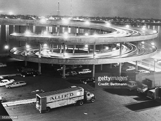 Detroit, Michigan: This nighttime, time exposure of traffic moving up and down the ramp leading to the parking lot atop Detroit's Cobo Hall seems to...
