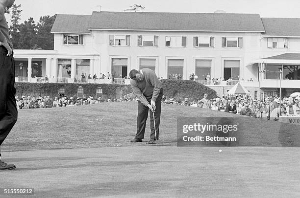 Billy Casper, of Apple Valley, California, chips to the green on the 18th here 1/21. Billy birdied the hole to finish the round with a 65, breaking a...