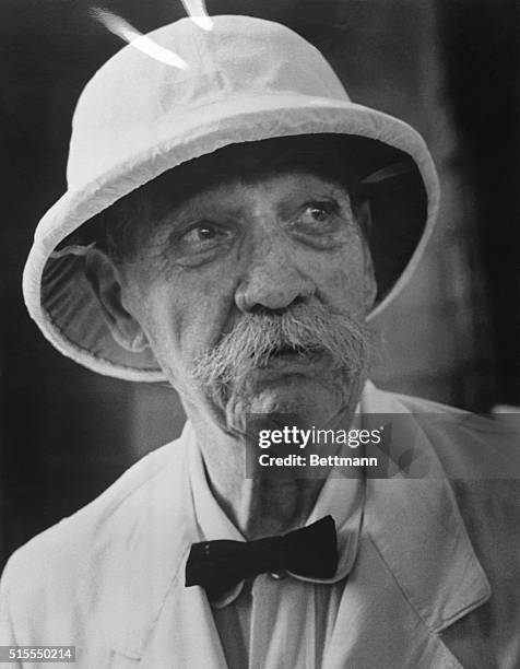 . One of the world's greatest humanitarians, Dr. Albert Schweitzer, still keen of eye and sturdy at 86, sends a sweeping look around his jungle...