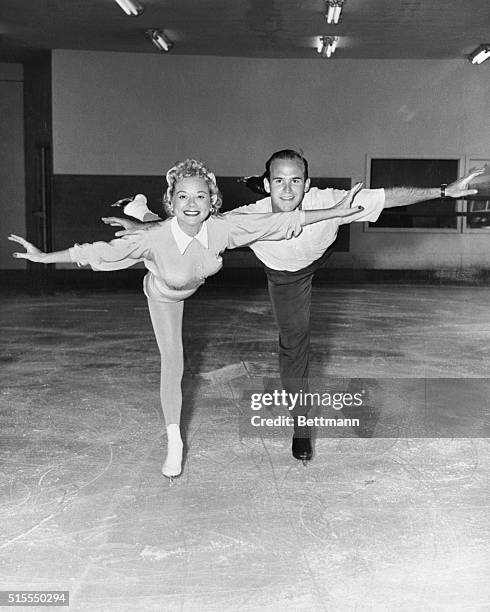 These two former world, U.S. And Olympic figure skating champions, Sonja Henie and Dick Button, of Englewood, N.J., met recently at the Westwood Ice...