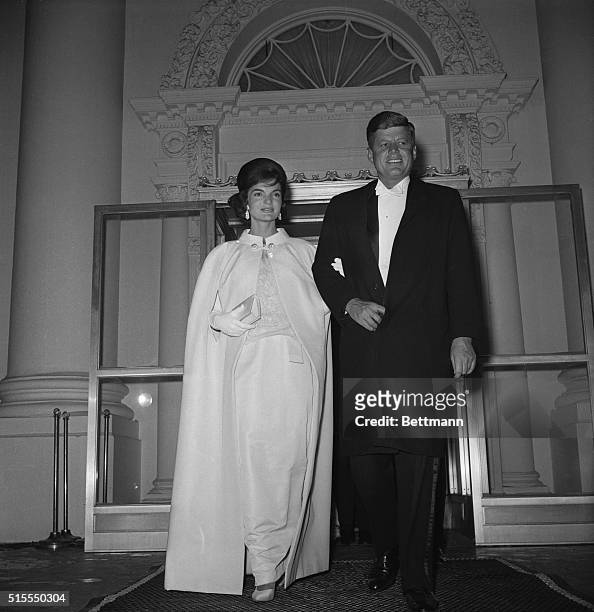 January 20, 1961 - Washington, D.C.: Full-length shot of President and Mrs. John F. Kennedy as they left the White House to attend a series of...