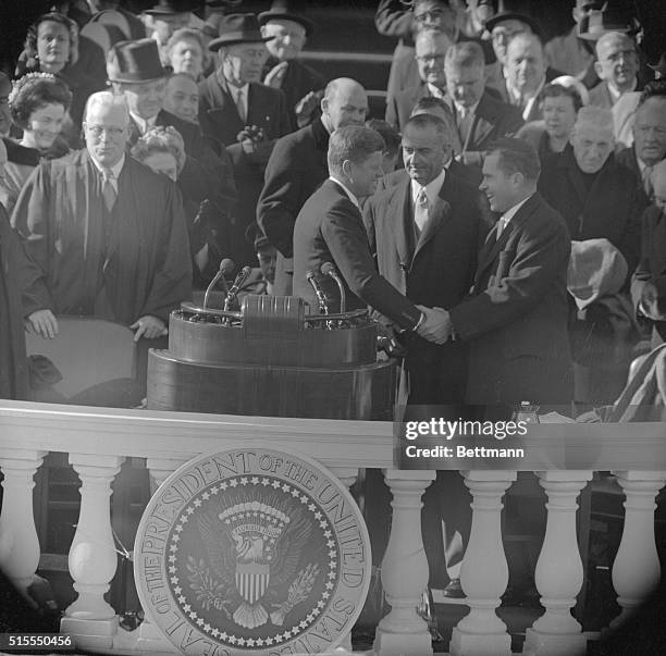 Outgoing Vice President Richard M. Nixon , defeated GOP standard bearer, congratulates President John F. Kennedy, January 20th, after Kennedy was...