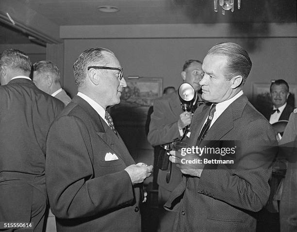 Comedian Bob Hope and Harold Lloyd, comedian of silent film days are in a serious mood here during the gala party given by Louella Parsons,...