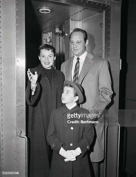 Judy Garland, daughter Liza and Judy's husband, Sid Luft, are shown as they arrived on the 20th Century from the West Coast this morning. They are...