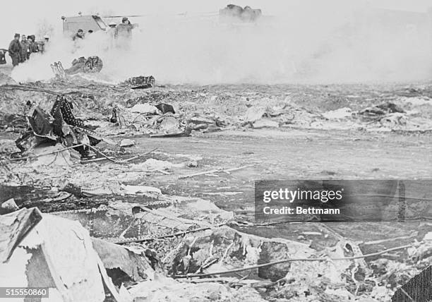 Rescue workers search over the wreckage site of a B-52 Stratofortress, which was carrying two unarmed nuclear weapons. Officials said there was no...