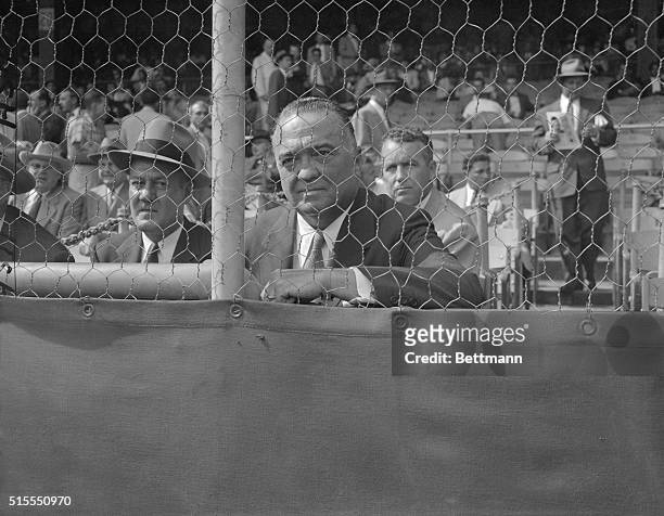 Edgar Hoover, Chief of the FBI, watches the New York Giants score a 5-2 victory over the Cleveland Indians today in the opening game of the 1954...