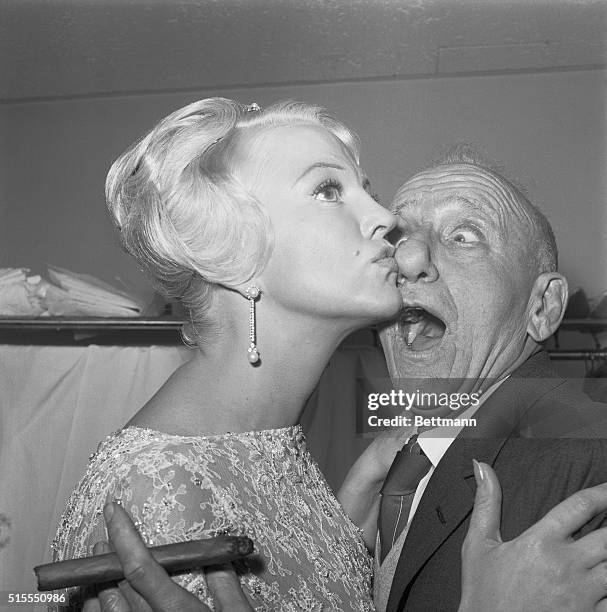 Getting busted in the nose is nothing to sniff about, says Jimmy Durante, whose considerable schnozzle is smacked by shapely song star Peggy Lee....