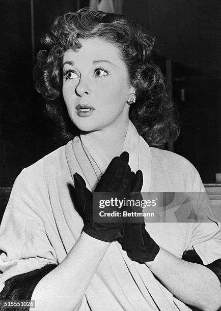 Susan Hayward is shown on the witness at and Wednesday as she asked permission over the objection of her divorced husband, Jess Barker, to take her...