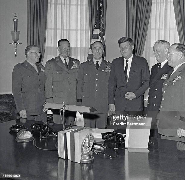 President John F. Kennedy meets with his Joint Chiefs of Staff in the Oval Office.