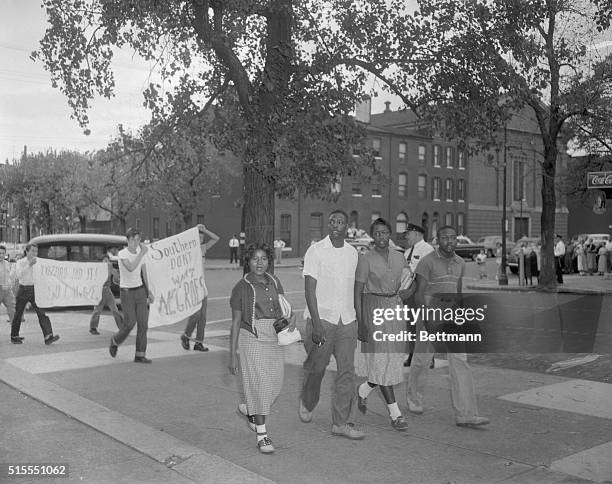 Negro students arrived at Southern this morning and white students walk behind holding sigh, "Southern Don't want Negros", and "Milford did it, so...