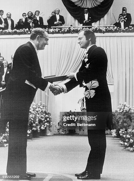 Stockholm: Nobel Award Distribution. Prof. Herbert A. Simon, USA, left, receives the Nobel Award in Economics by King Carl Gustaf of Sweden in the...