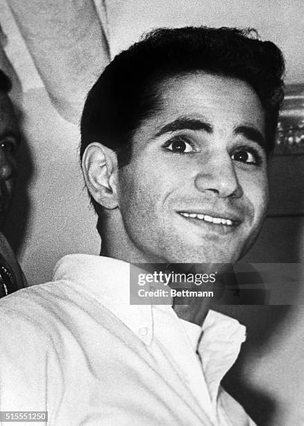 Los Angeles, CA- Sirhan Sirhan, accused slayer of Robert F. Kennedy, smiles at newsmen during his fourth appearance in court. Sirhan was granted a...