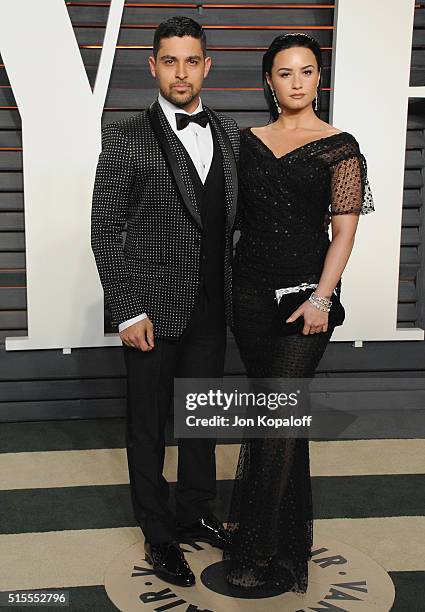 Actor Wilmer Valderrama and singer Demi Lovato arrive at the 2016 Vanity Fair Oscar Party Hosted By Graydon Carter at Wallis Annenberg Center for the...