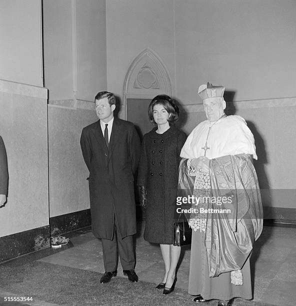 Boston: Senator Edward Kennedy and Mrs. Jacqueline Kennedy are greeted by Richard Cardinal Cushing as they arrived at the Holy Cross cathedral for...