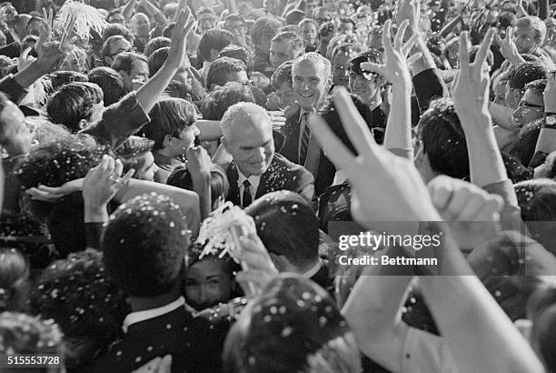 Los Angeles: Democratic Senatorial candidate Alan Cranston is showered with confetti, as he entered the Cranston headquarters in the Biltmore Hotel...