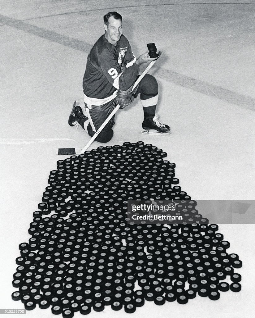 Gordon Howe on Ice With Hundreds of Pucks