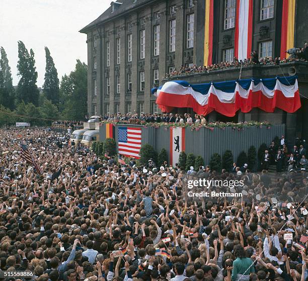 Berlin, Germany: President JFK waves to the crowd in front of the City Hall.