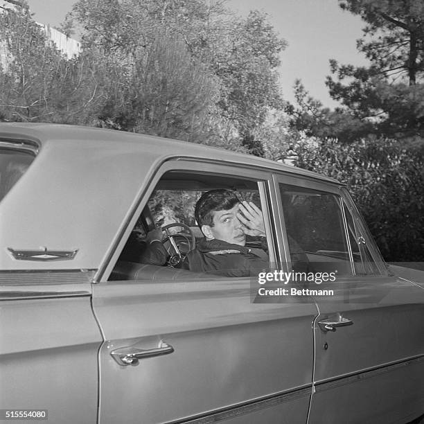 Frank Sinatra Jr. Waves to photographers, as he leaves his mother's home here with FBI agents to visit the home in Canoga Park where his kidnapers...